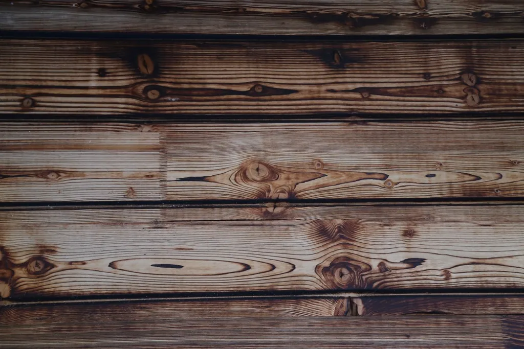 Weathered, warm timber planks — the quiet patina of wood in daily use