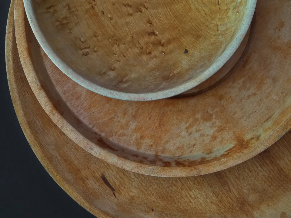 Hand-turned wooden bowls stacked on a table
